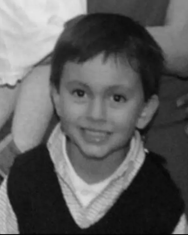 Juan Felipe de niño, sonriendo.